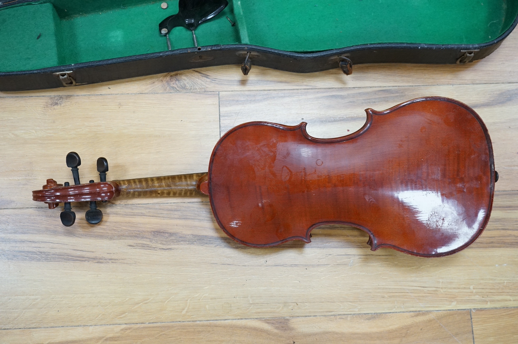 An early 20th century violin, possibly Czech, with internal label for ‘Maidstone Orchestra Association, Oxford St. London’ and bow, in case, length of back of body, 36cm., Condition - fair to good.